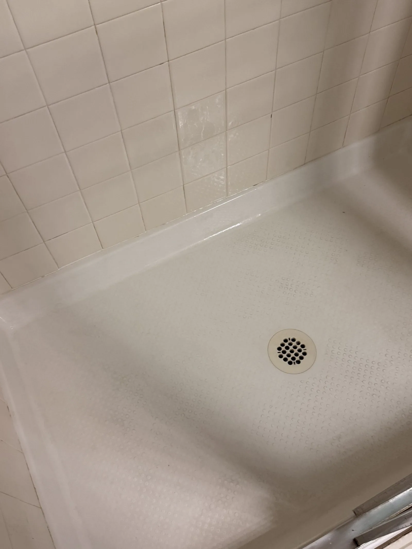 Second shower pan gleaming white and scum-free after L&G Cleaning